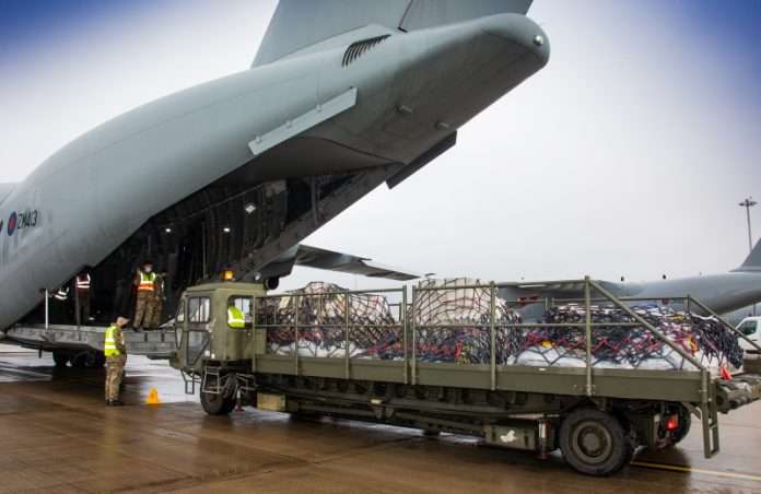 Pictured are RAF movers at RAF Brize Norton loading Oxford AstraZeneca vaccines onto a LXX Squadron (70 Sqn) ATLAS (A400M). Photo credit: MOD crown copyright