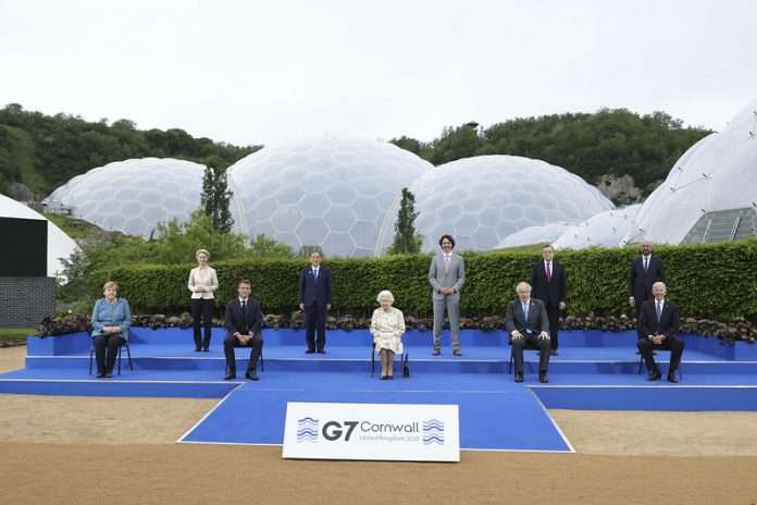 Eden Project, G7 Leaders’ Summit, Cornwall. Her Majesty, Queen Elizabeth II, sits for a group photograph with all the G7 leaders at the Eden Project before the G7 leaders’ evening dinner and reception. Picture by Andrew Parsons / No 10 Downing Street