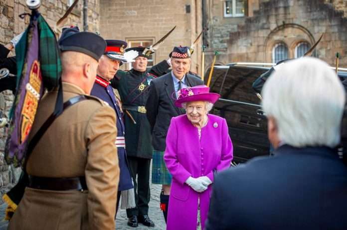 Image of Major Gordon Rowan, Director Army Bagpipe Music (DABM), bagpiping her Majesty The Queen out of Stirling Castle to the tune of St Andrews Cross.