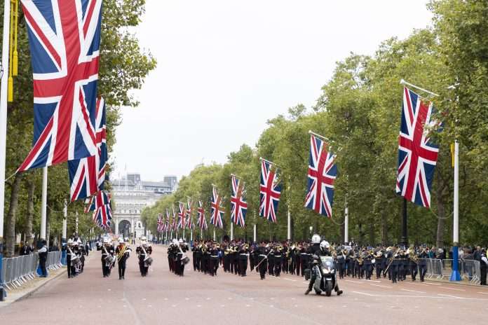 Pictured are the UK Armed Forces Tri Service Marching Band leading the parade down The Mall to the Palace. PO Photo credit: PHOT Dave Jenkins - UK MOD © Crown copyright 2021