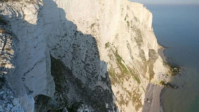 Kent coast cliffs editorial White cliffs on the Kent coast under daytime sky, generic coastal scene