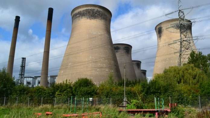 Cooling towers at a British power station under grey sky
