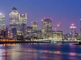 Treasury refuses to tell MPs value of JP Morgan’s business rates break The Canary Wharf skyline lit up at dusk, seen across the River Thames from Limehouse