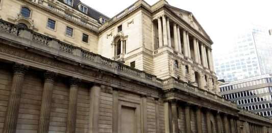 The Bank of England building on Threadneedle Street in the City of London with pedestrians passing, file photograph