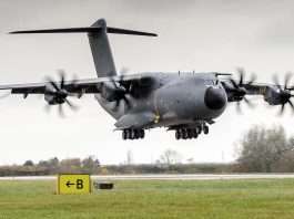 An RAF A400M Atlas transport aircraft coming in to land over grass at an airfield, file photograph